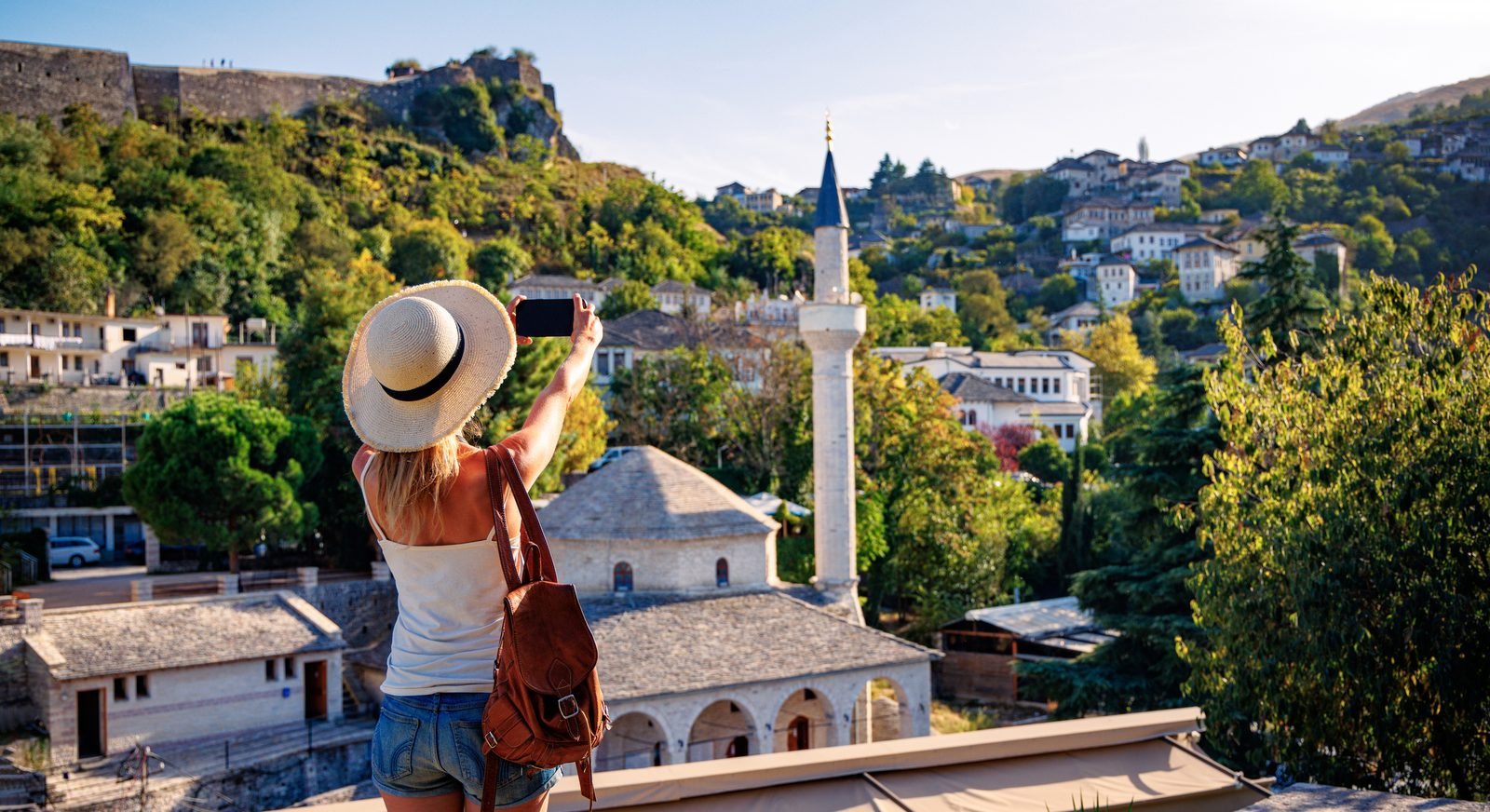 Traveller photographing the historic town of Gjirokast&euml;r